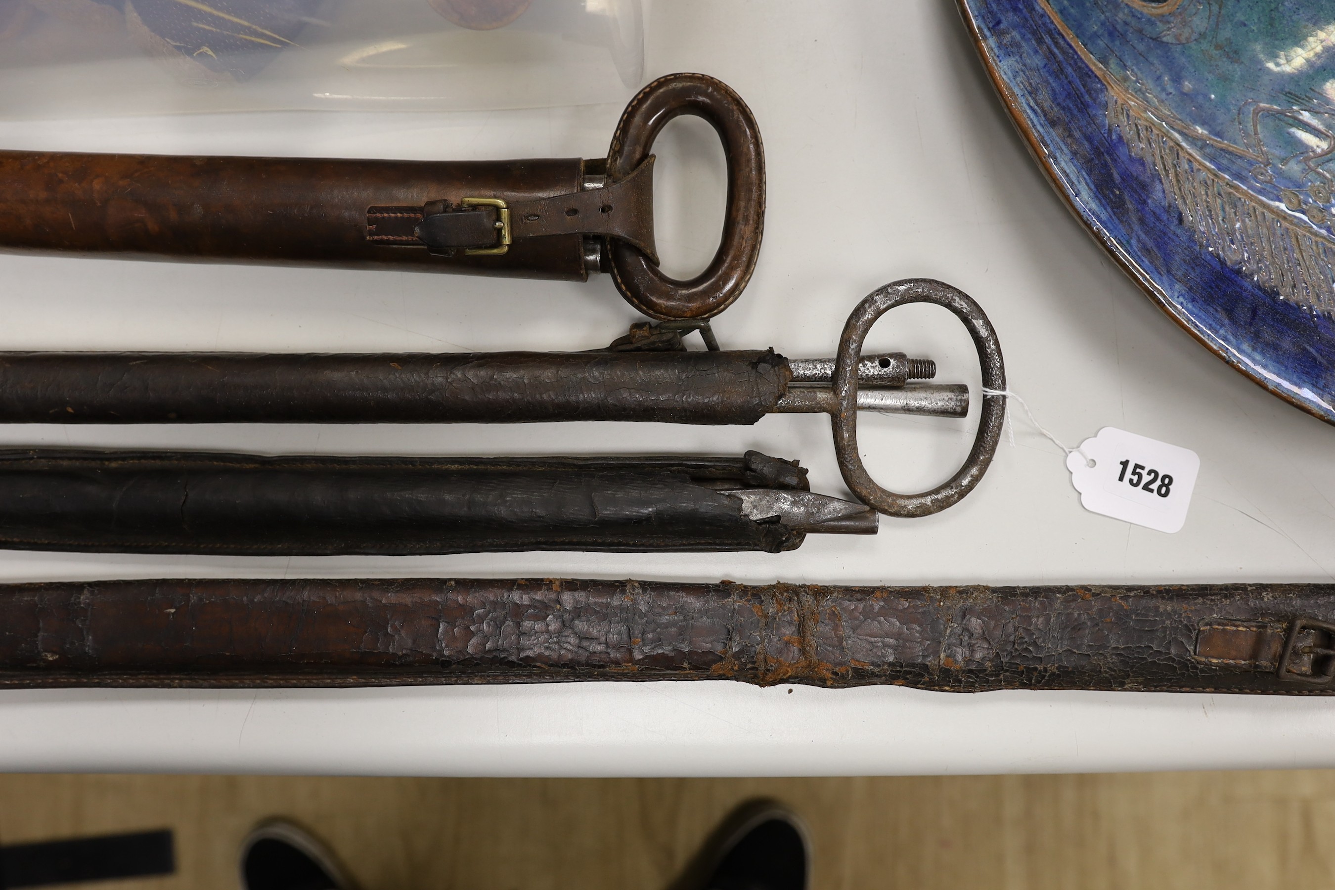 Four Victorian surveyors measuring rods, in leather cases